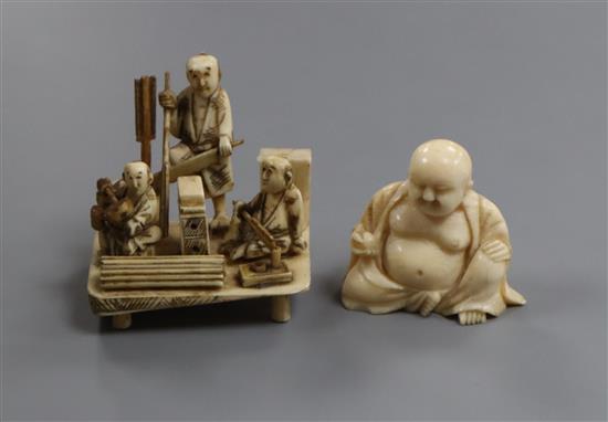 A Japanese ivory okimono of three craftsmen and a Chinese ivory figure of Budai